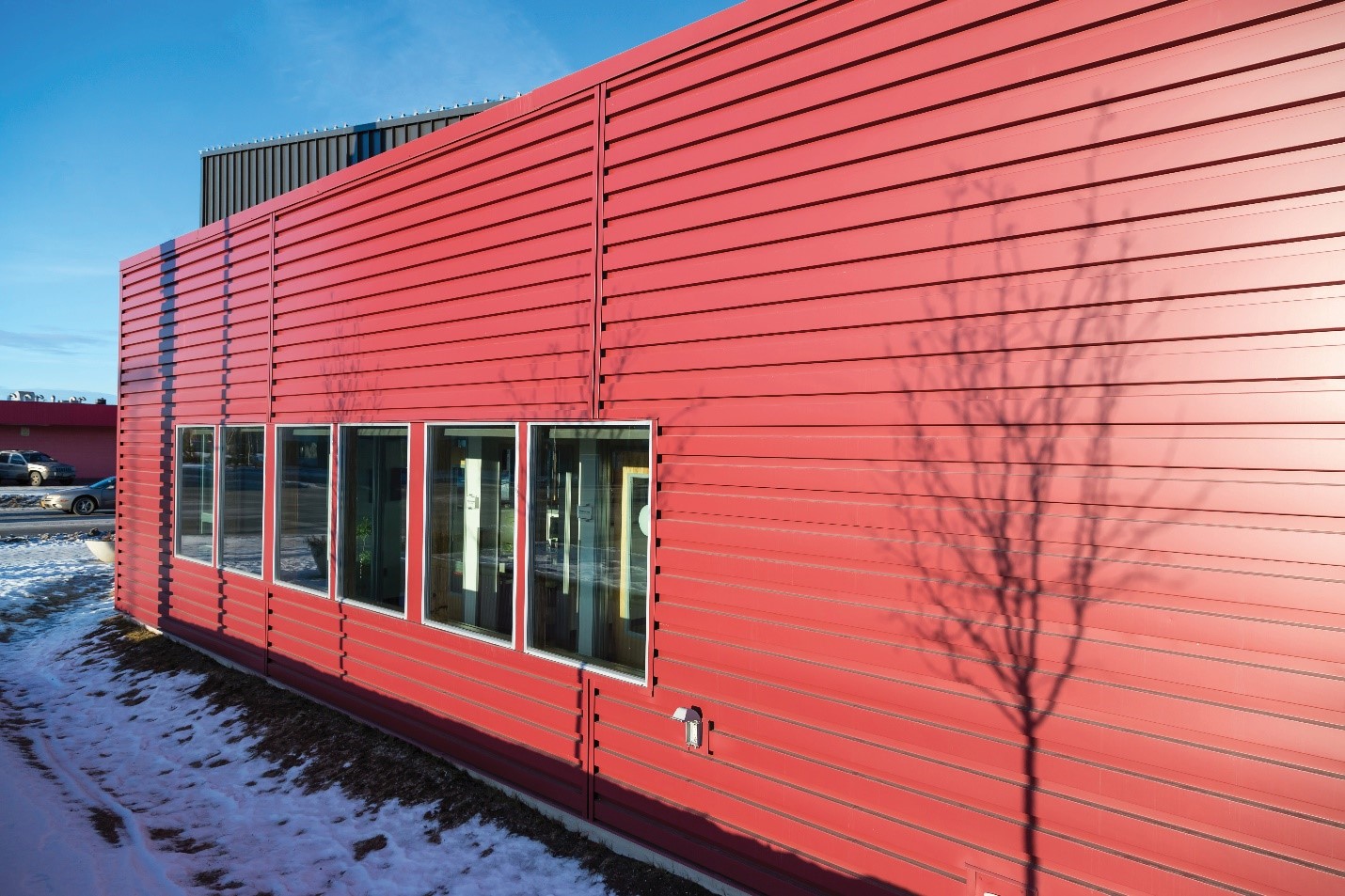Bright red siding on an office building.