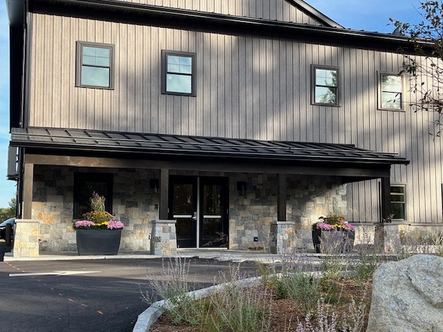 Matte Barnwood was selected for the siding on this solid core building in Moultonborough, NH. This finish offers aesthetics and durability.