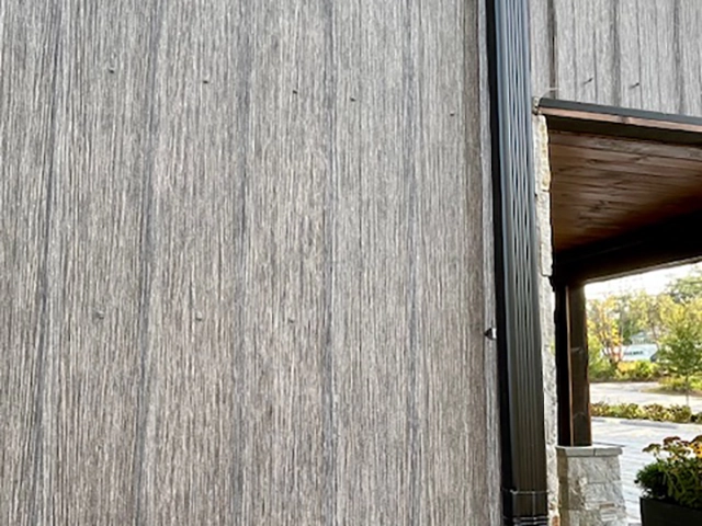 Matte Barnwood was selected for the siding on this solid core building in Moultonborough, NH. This finish offers aesthetics and durability.