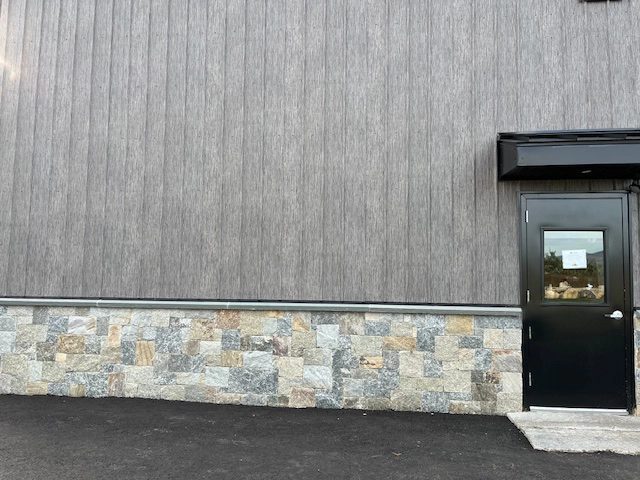 Matte Barnwood was selected for the siding on this solid core building in Moultonborough, NH. This finish offers aesthetics and durability.