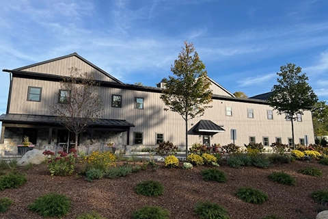 Matte Barnwood was selected for the siding on this solid core building in Moultonborough, NH. This finish offers aesthetics and durability.