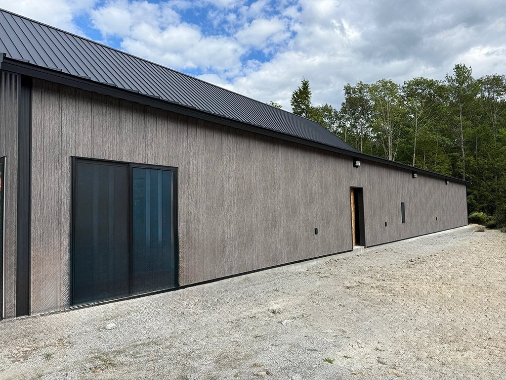 Matte Barnwood Barndominium in Maine featuring genuine Steelscape steel. Metal siding offers a matte finish for optimum realism and design.