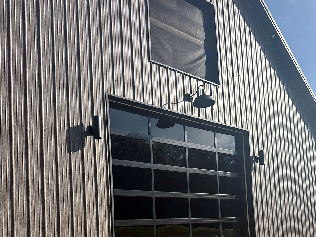 Matte Barnwood Barndominium in Maine featuring genuine Steelscape steel. Metal siding offers a matte finish for optimum realism and design.