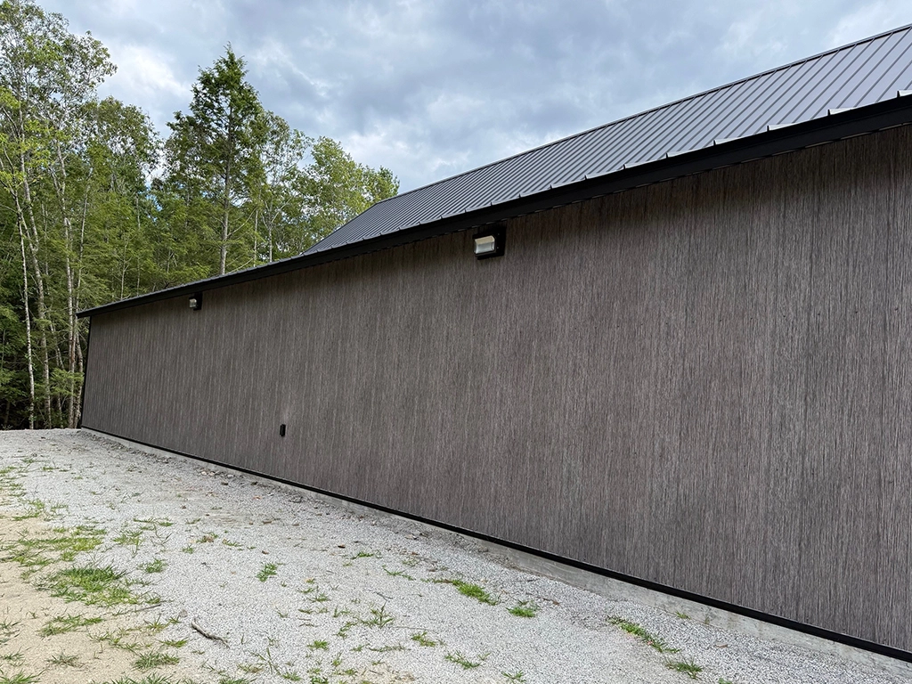 Matte Barnwood Barndominium in Maine featuring genuine Steelscape steel. Metal siding offers a matte finish for optimum realism and design.