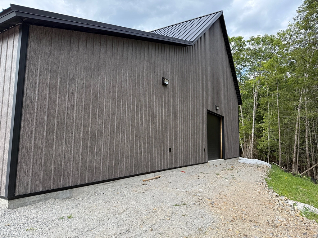 Matte Barnwood Barndominium in Maine featuring genuine Steelscape steel. Metal siding offers a matte finish for optimum realism and design.
