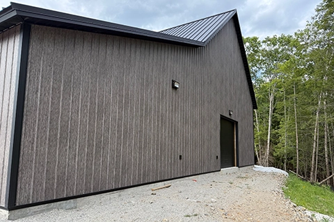 Matte Barnwood Barndominium in Maine featuring genuine Steelscape steel. Metal siding offers a matte finish for optimum realism and design.